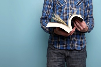 man-in-plaid-reading